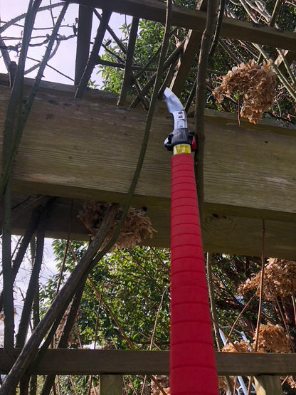 ARS Featherlight Pole Saw being used to cut a woody branch