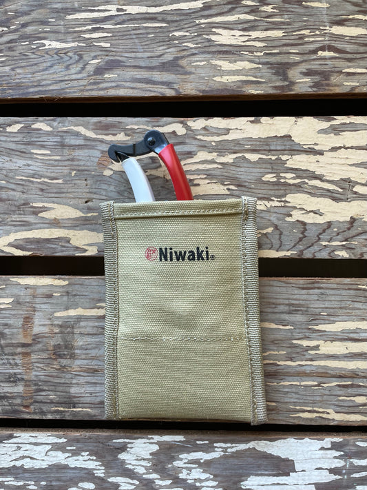 Niwaki Back Pocket Pouch holding Okatsune Secateurs