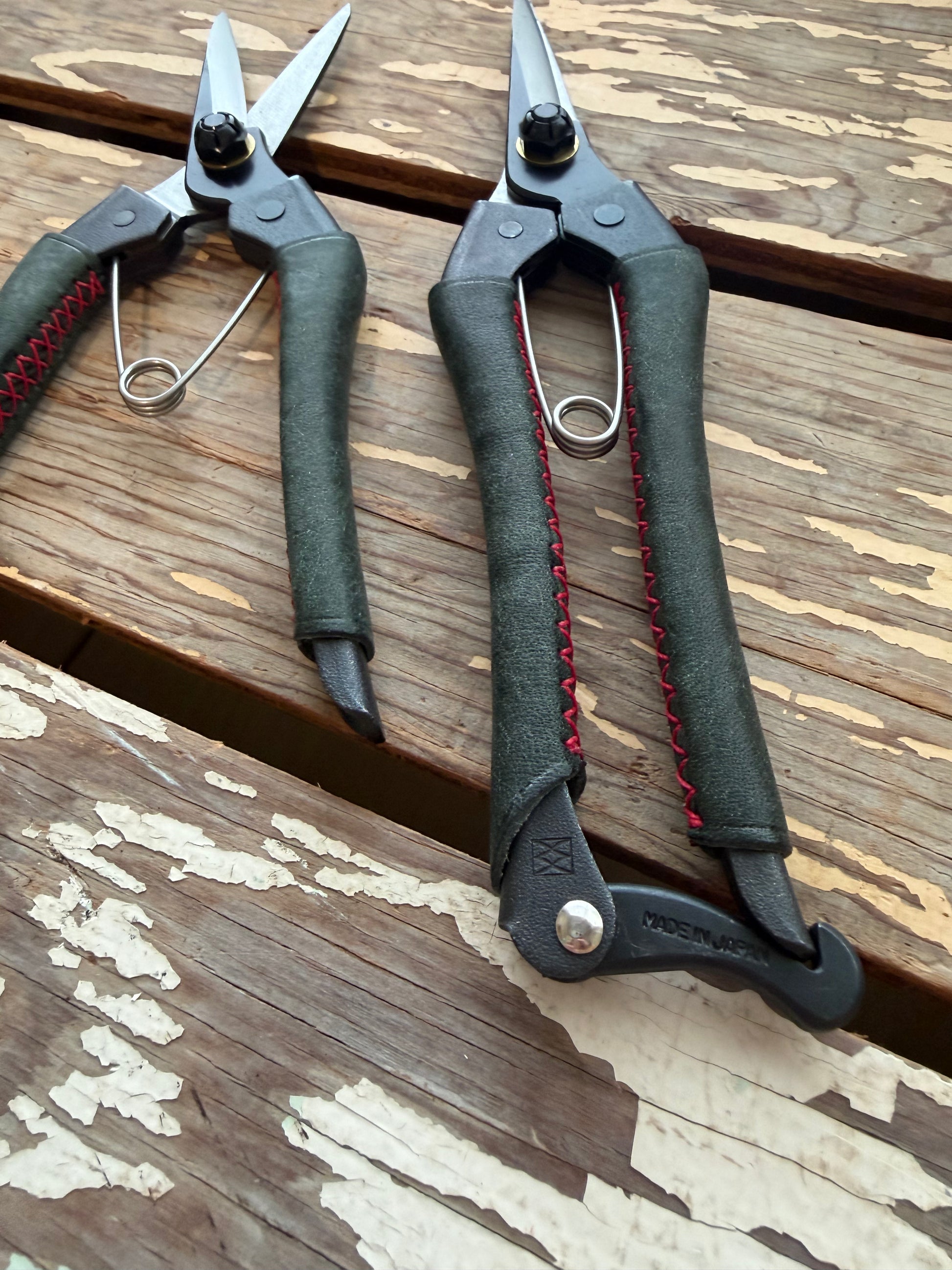 Two pairs of Kuroco Leather Snips on display table