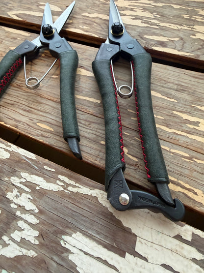 Two pairs of Kuroco Leather Snips on display table
