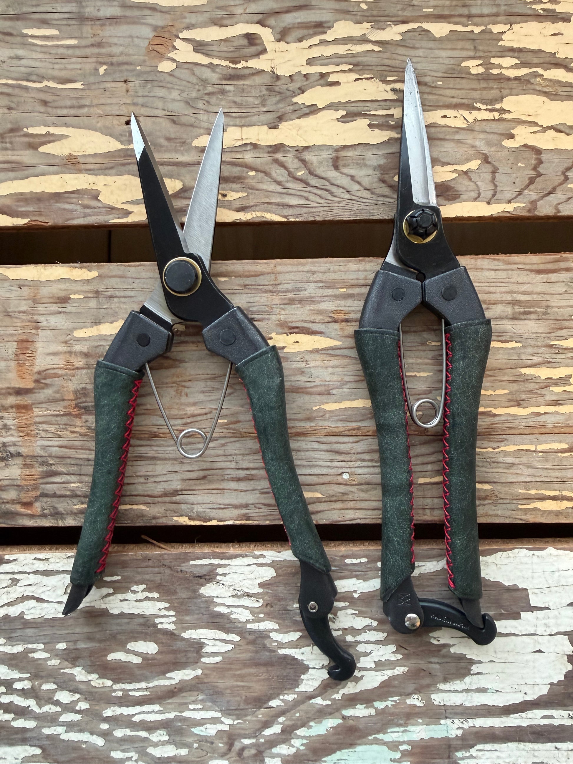Two pairs of Kuroco Leather Snips on display table