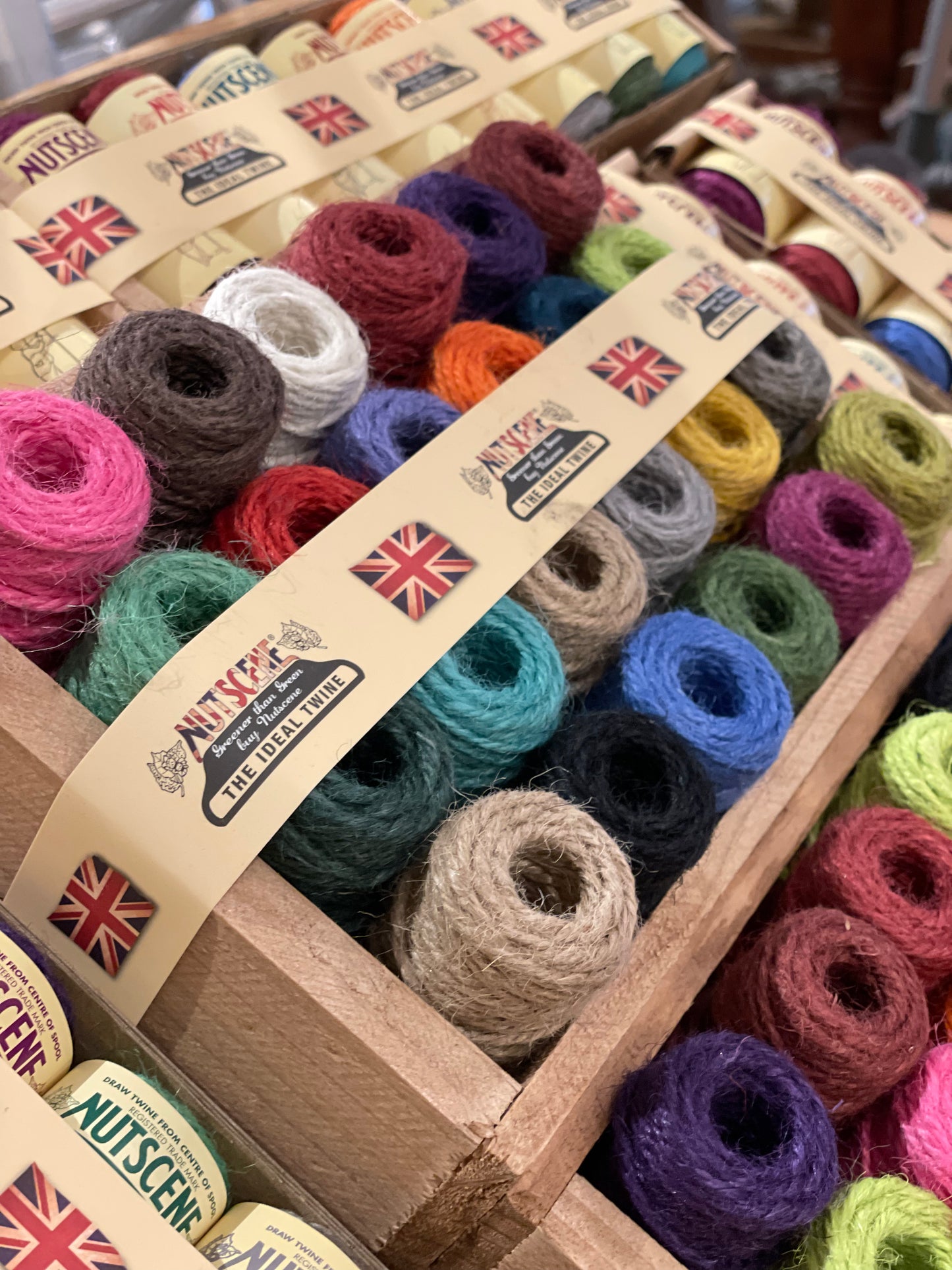 Close up of Nutscene Mini Spools in Wooden Crate