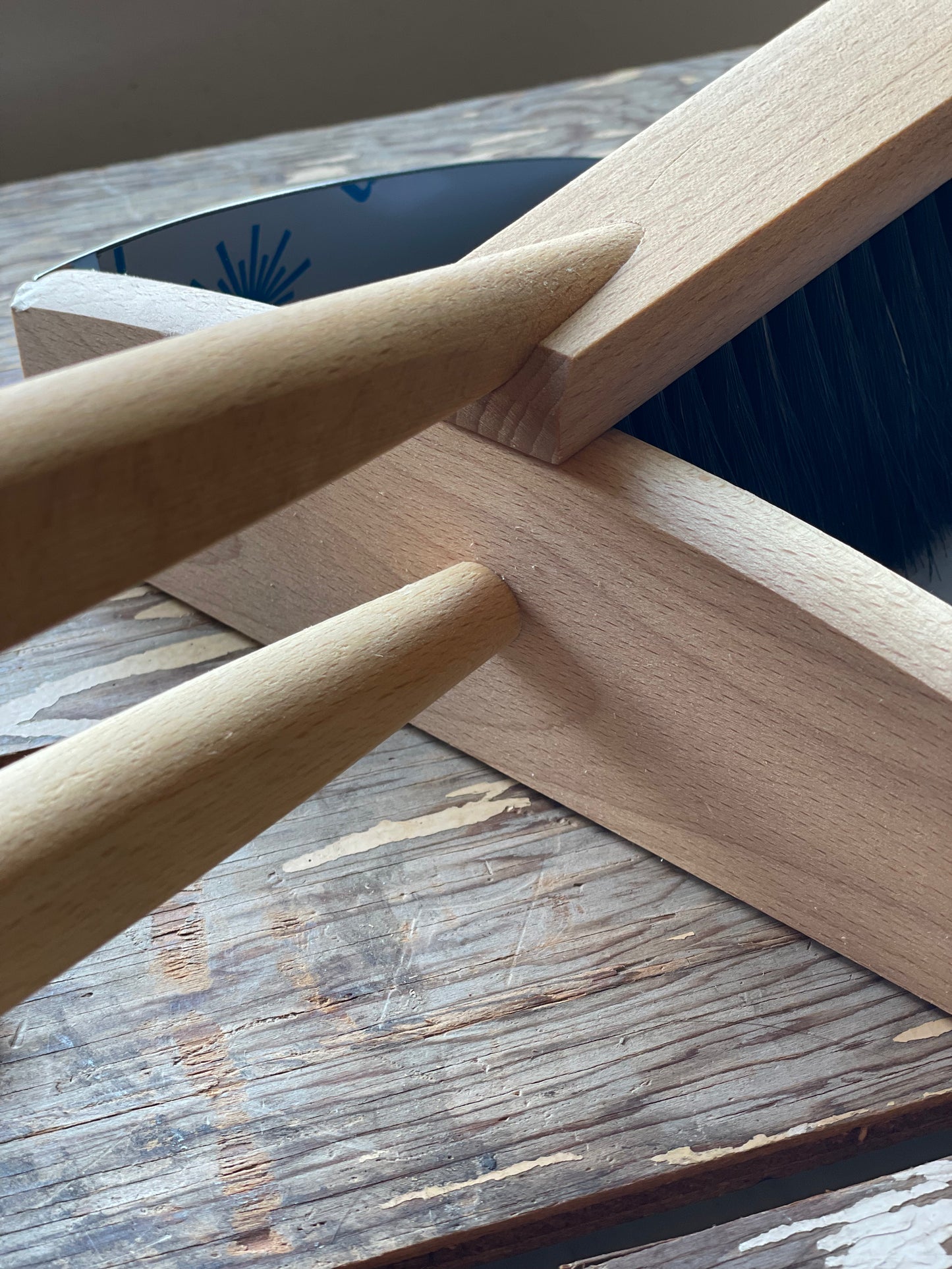 Close-up of Redecker Hand Brush & Dustpan set handles