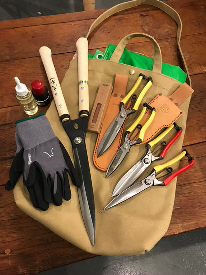 Daikon Tool Tote pictured with Niwaki pruning tools and gardening gloves