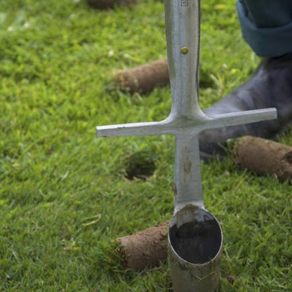 Sneeboer Great Dixter Bulb Planter being used to extract soil cores for bulb planting