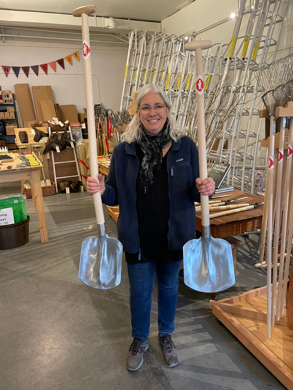 Sneeboer Mulching Shovels being held up in the Gardener's Kit showroom