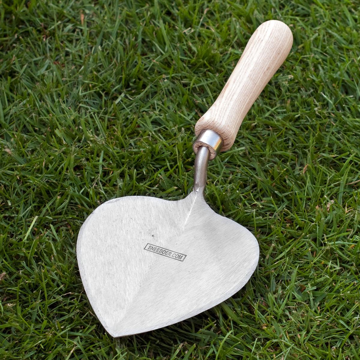Sneeboer Planting Trowel Old Dutch Style - Short handle, photographed on grass background