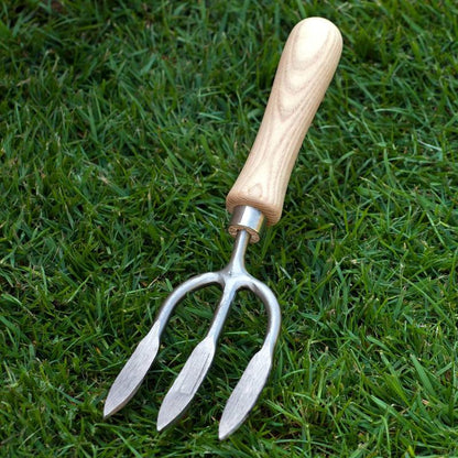 Sneeboer Weeding Fork on grass background